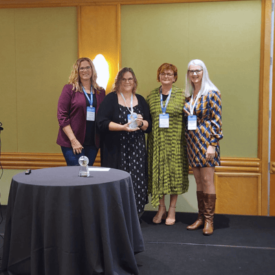 Lori Lee and Melissa Keown of the Canadian Cardiovascular Society (CCS) accept their award at iNNOVATIONS Canada with ASI's Kristina Drosos, Director, Client Experience and Linda Morrison, Country Manager – Canada